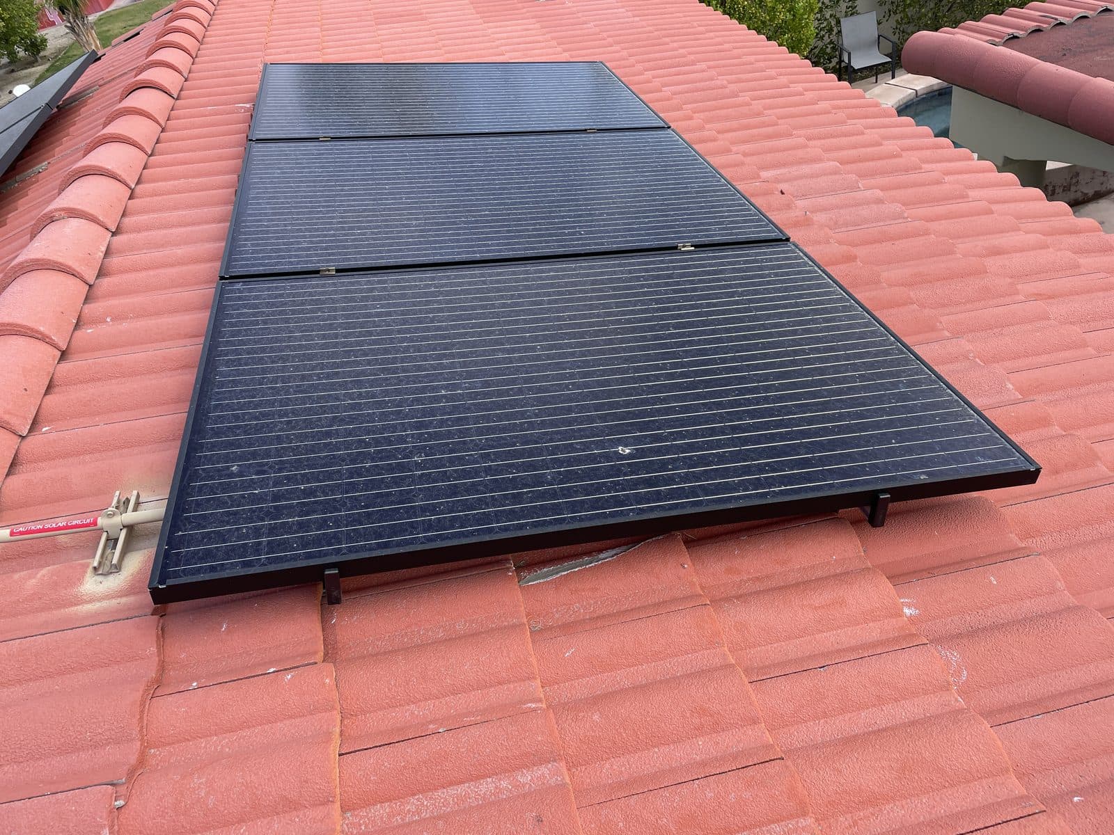 All-black solar panels installed on a Spanish tile roof in Palm Springs, CA