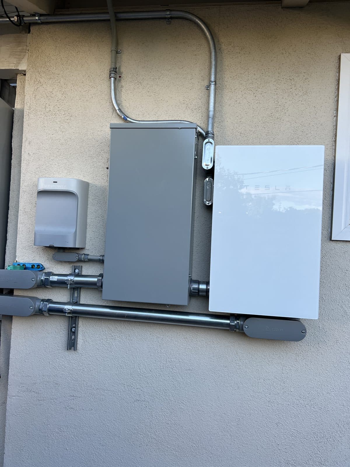 Tesla Powerwall retrofit installed beside existing SunPower solar equipment in Thousand Oaks, CA