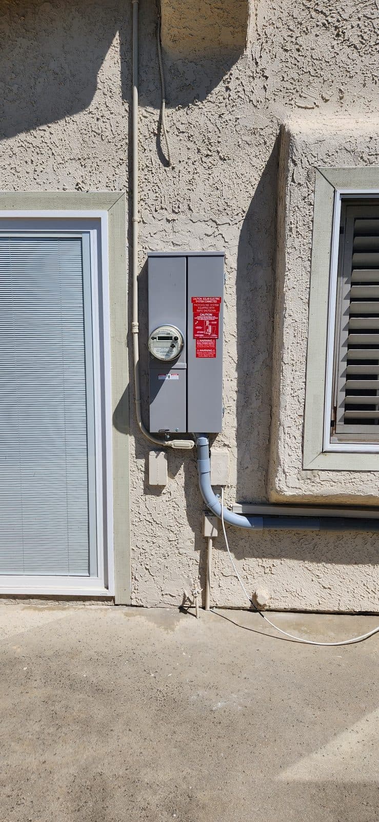 Solar service panel with rapid-shutdown labeling at a Helios install in Thousand Oaks, CA