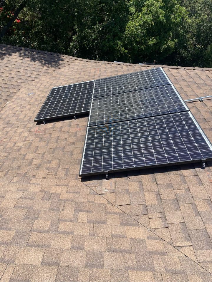 Solar panel installation on a shingle roof among oak trees in Topanga Canyon, CA
