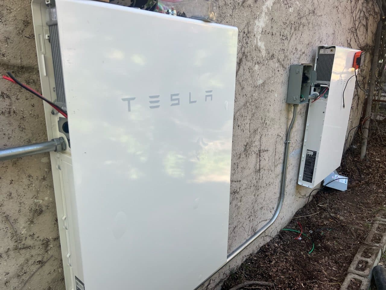 Two Tesla Powerwalls being installed at a home in Altadena, CA